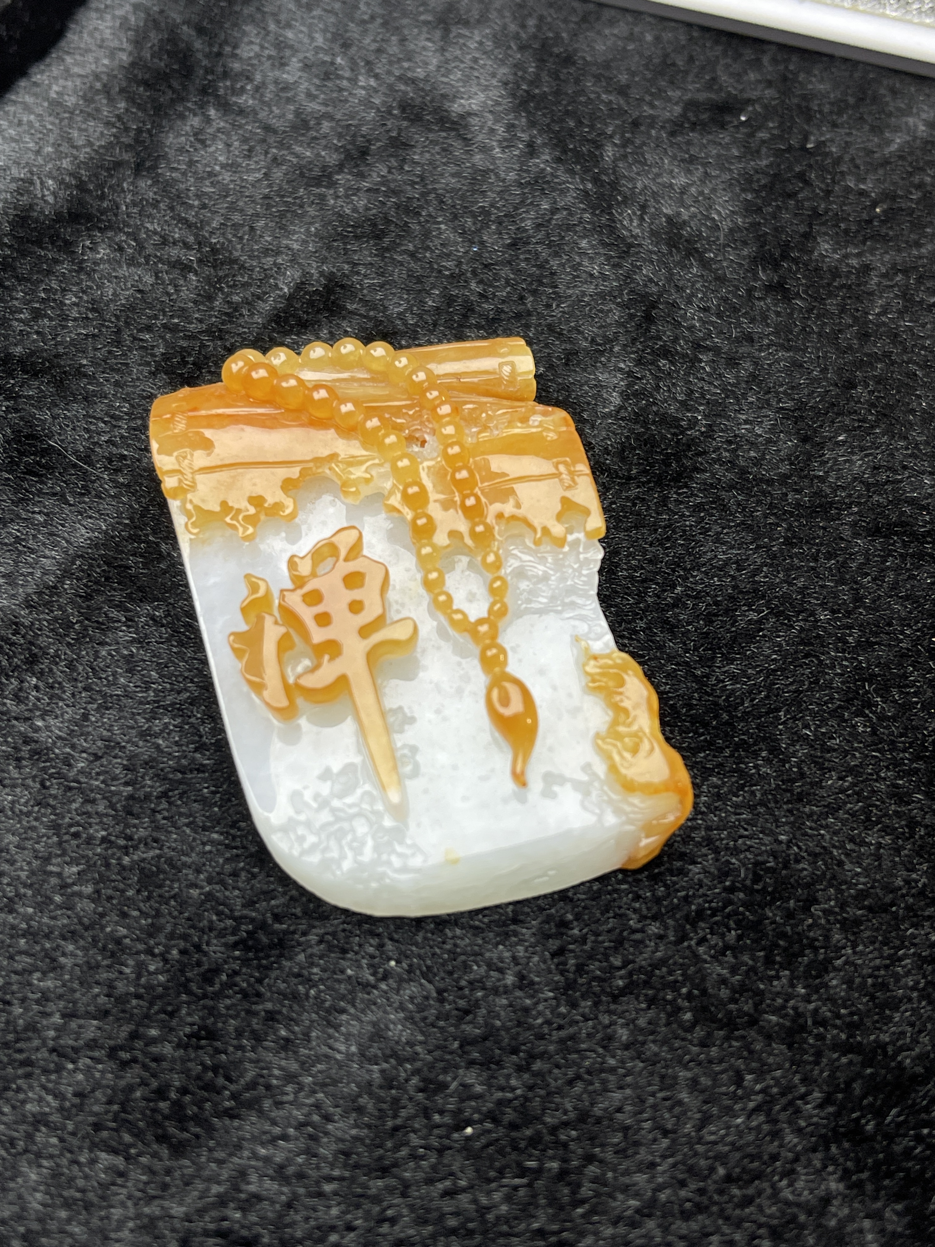 A scroll of scriptures tilts, a thought enters meditation The Dhamakan yellow jade shows a charming colour