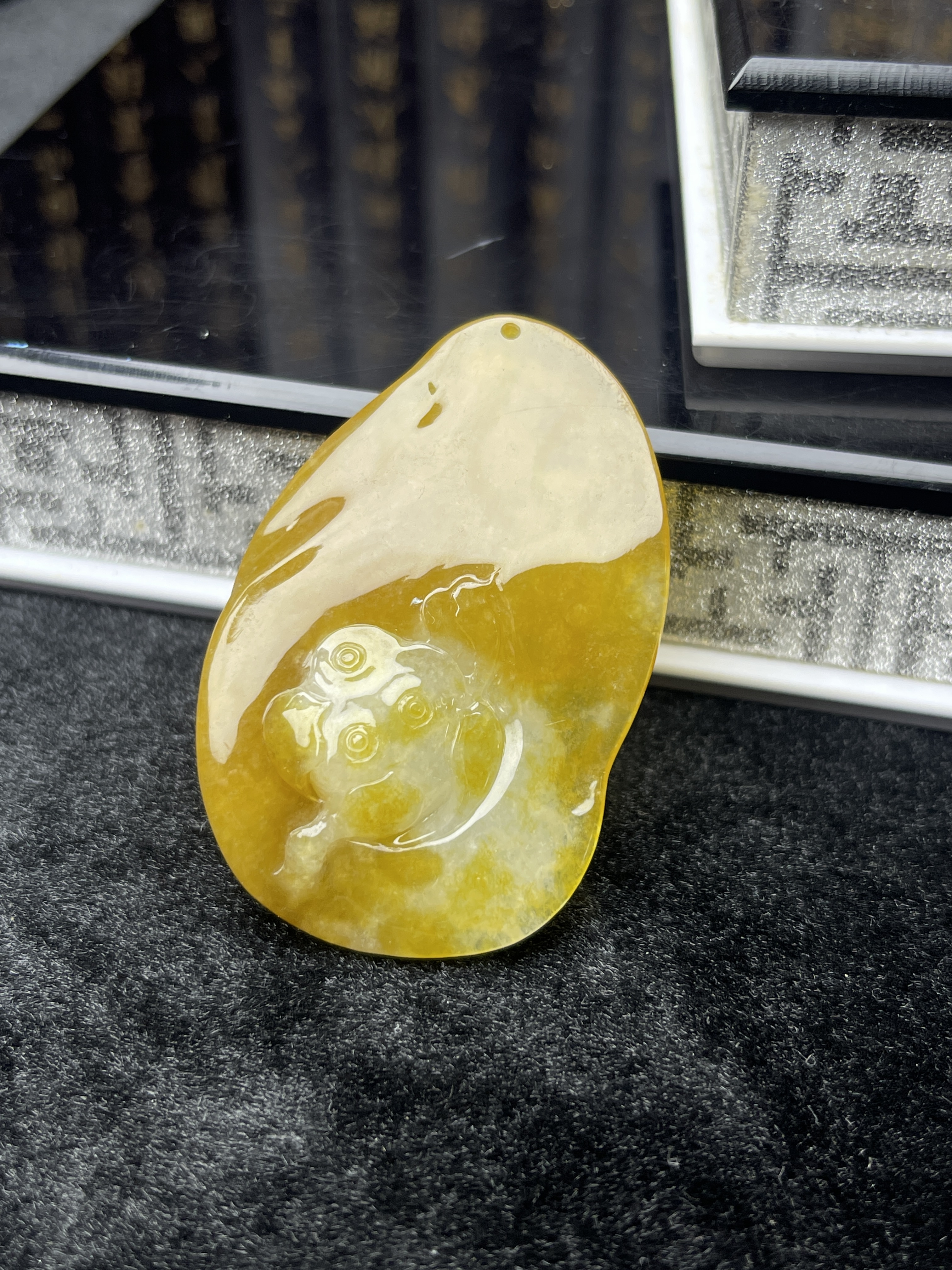 Golden yellow delicately carved White Tara pendant