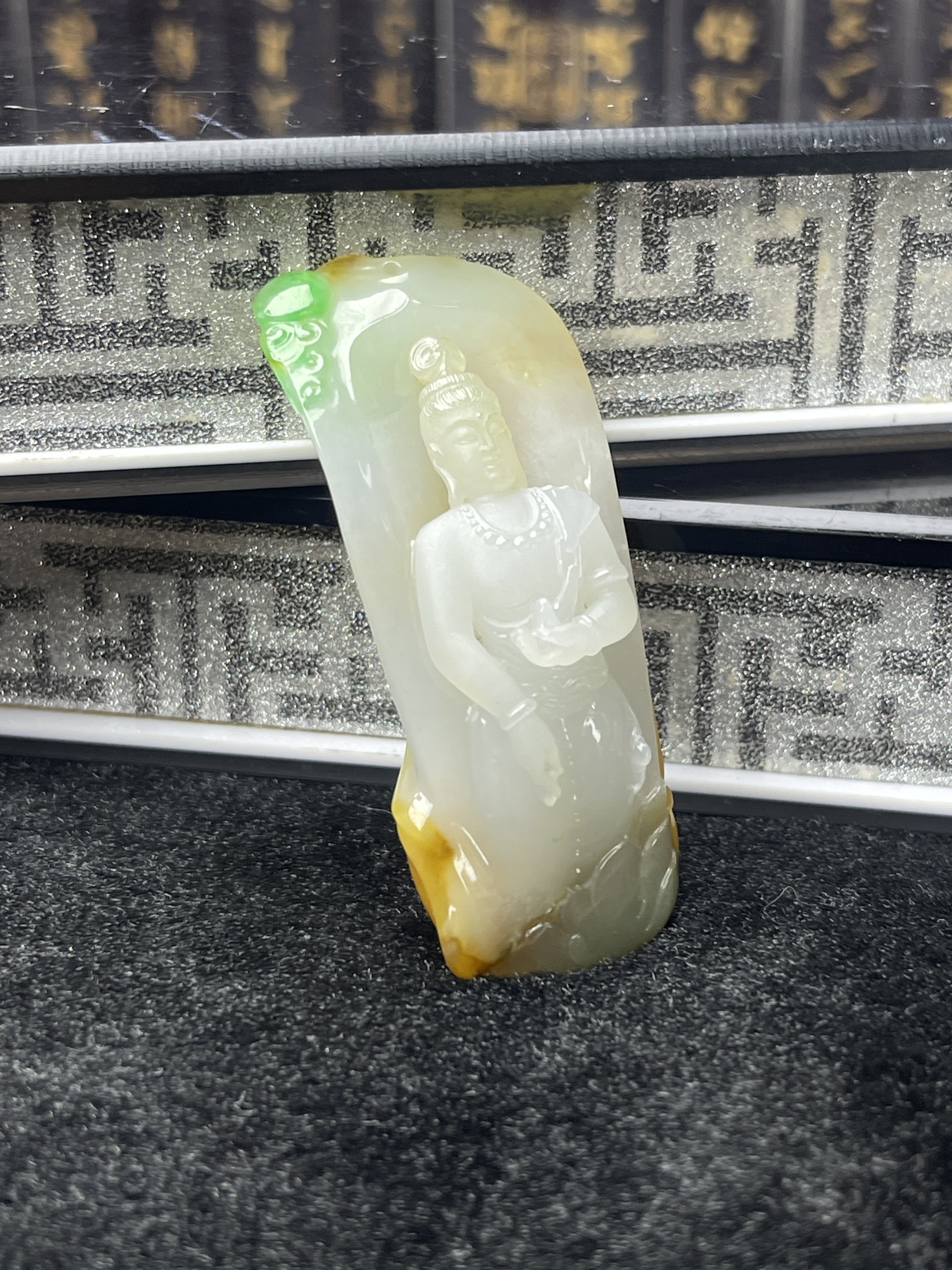 Yellow and green jade Guanyin pendant in a cute little bottle