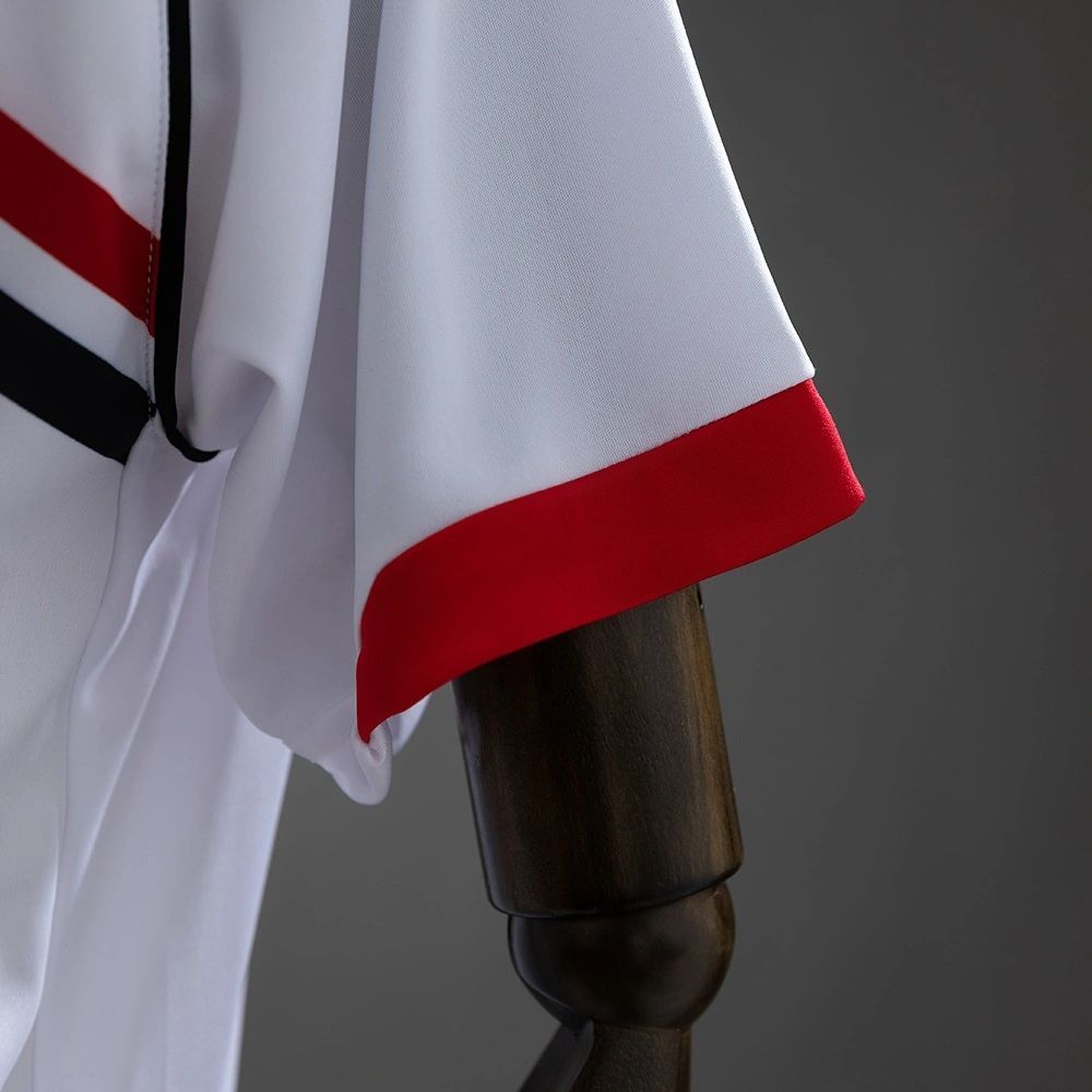 Sleeve detail of the Osasuna 2010-11 retro away jersey featuring white fabric with red cuff trim.