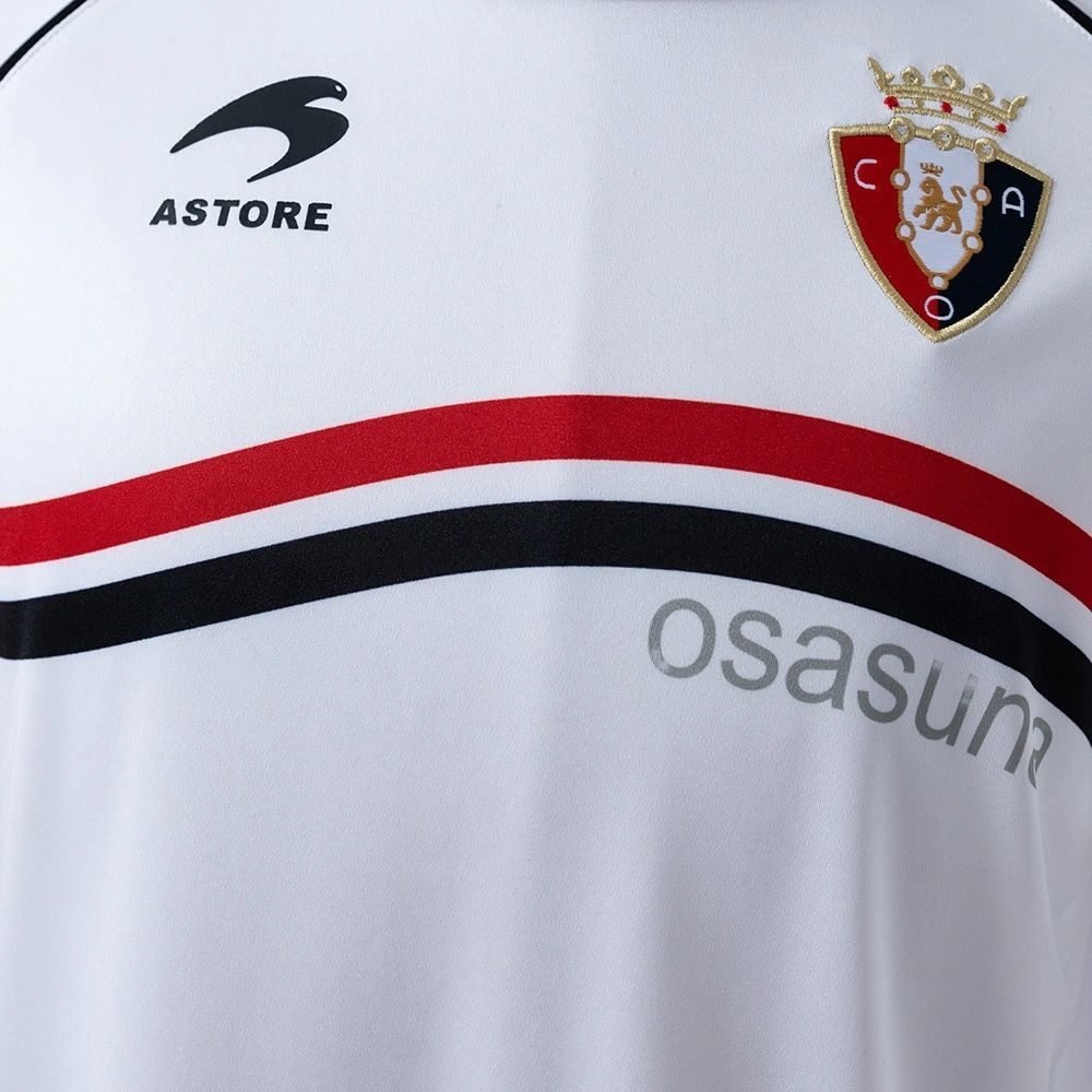 Front chest view of the retro Osasuna 2010-11 away jersey showing red and black curved stripes and Astore branding.