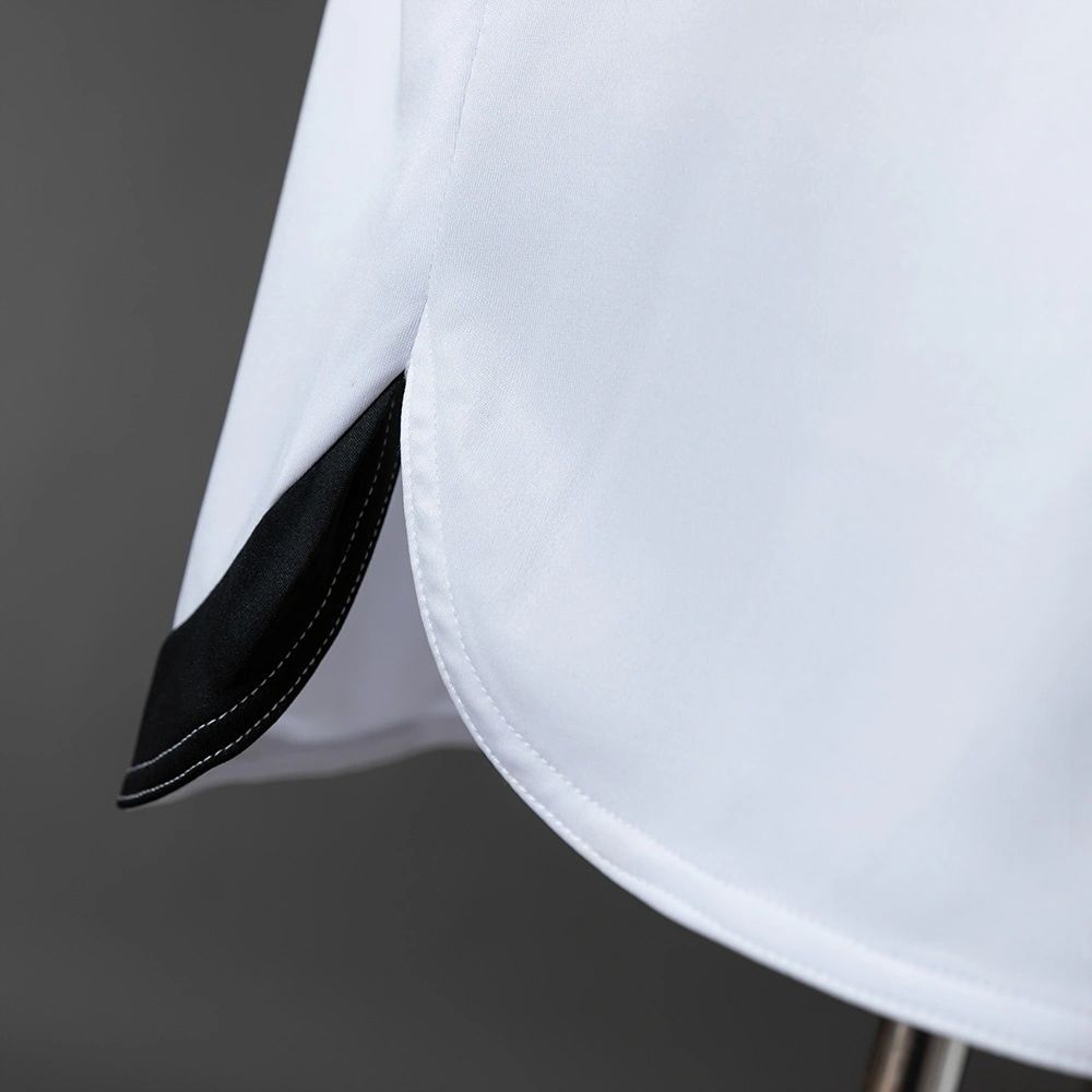 Lower hem and side slit detail of the retro Osasuna 2010-11 away jersey with black inner trim.