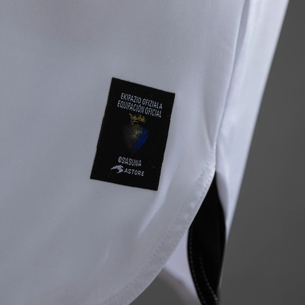 Official equipment authenticity patch on the lower front of the retro Osasuna 2010-11 away jersey.