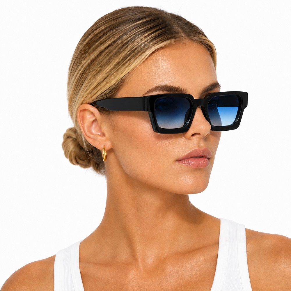 Model wearing black oversized square sunglasses with thick full-rim frame and gradient blue lenses