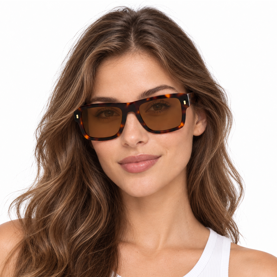 Model wearing tortoiseshell acetate square sunglasses with brown tinted lenses