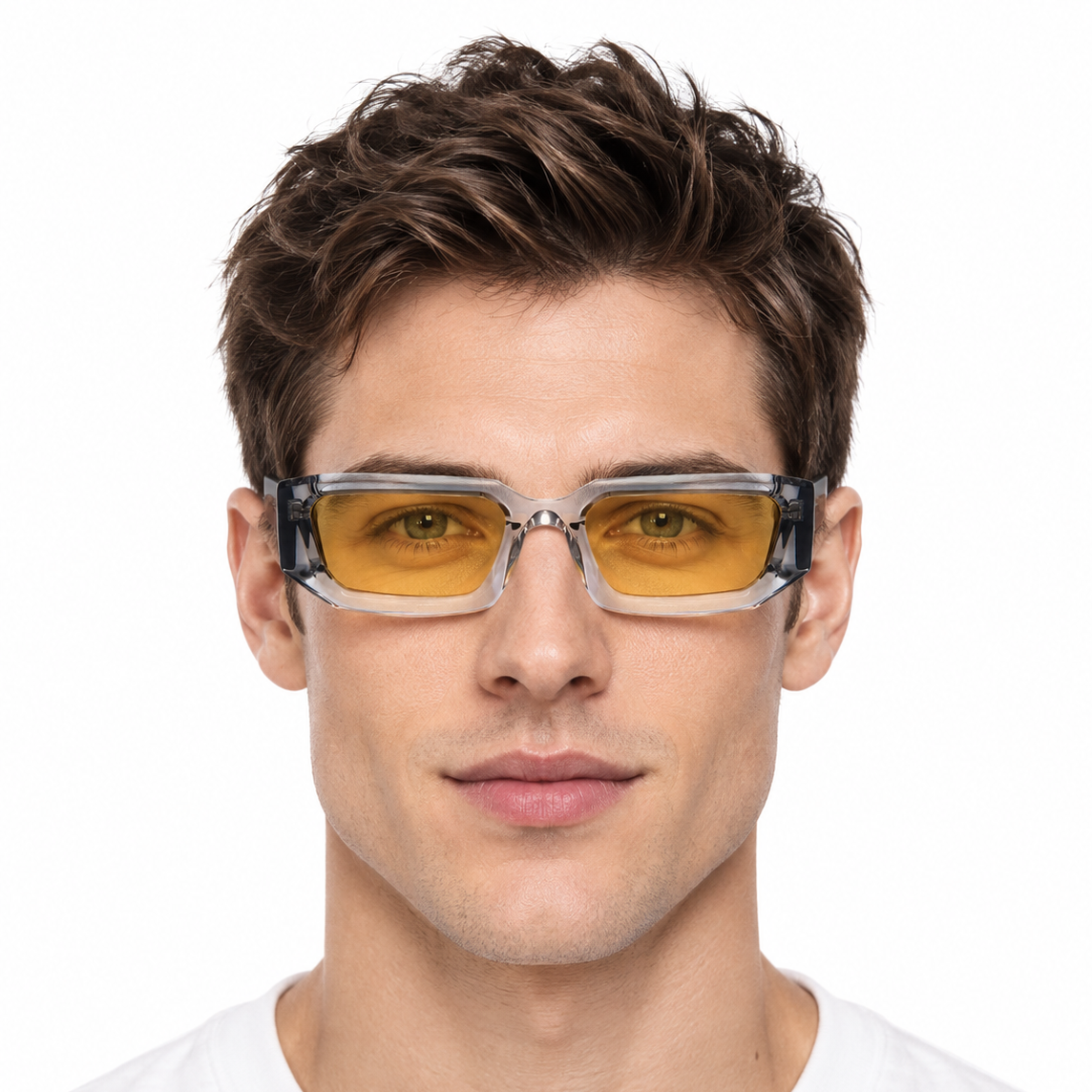 Model wearing clear gray full-rim rectangular sunglasses with amber-yellow lenses