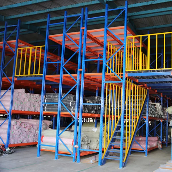 Actual HEDA multi-tier racking installation showing blue upright frames, orange shelving levels, yellow safety railings and steel access stairs
