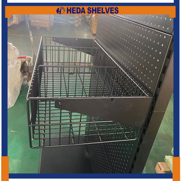 Close-up original photograph of the PDS04 rectangular black wire basket with open wire base, front guard, solid side supporting bracket and attachment to the round-hole pegboard