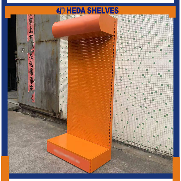 Original angled factory photograph of the orange PDS06 showing the curved projecting canopy, slim perforated panel with round holes, side support and open lower merchandise platform