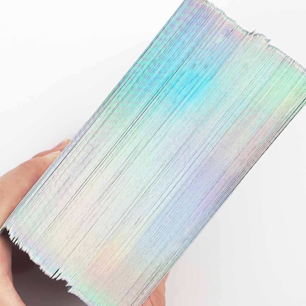 Holographic gilded edge tarot cards with reflective rainbow foil edge finish and custom card back design by THRIWA