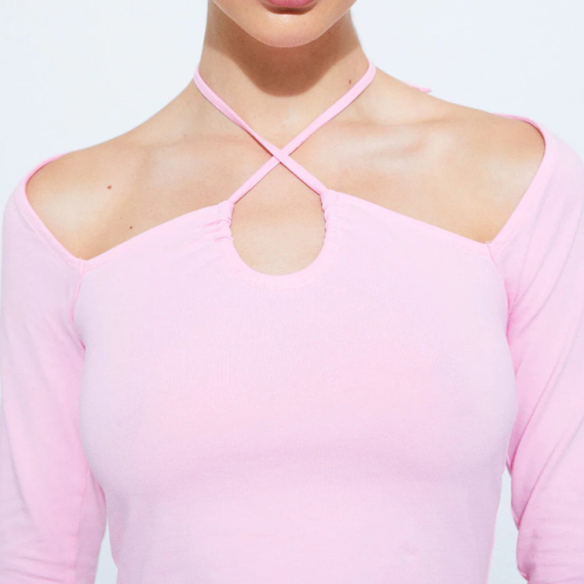 Long-sleeved top with straps on the neckline