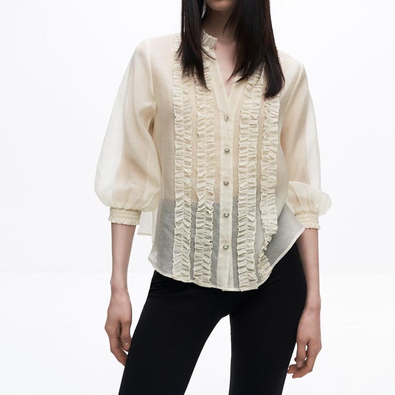 layered embellished translucent shirt