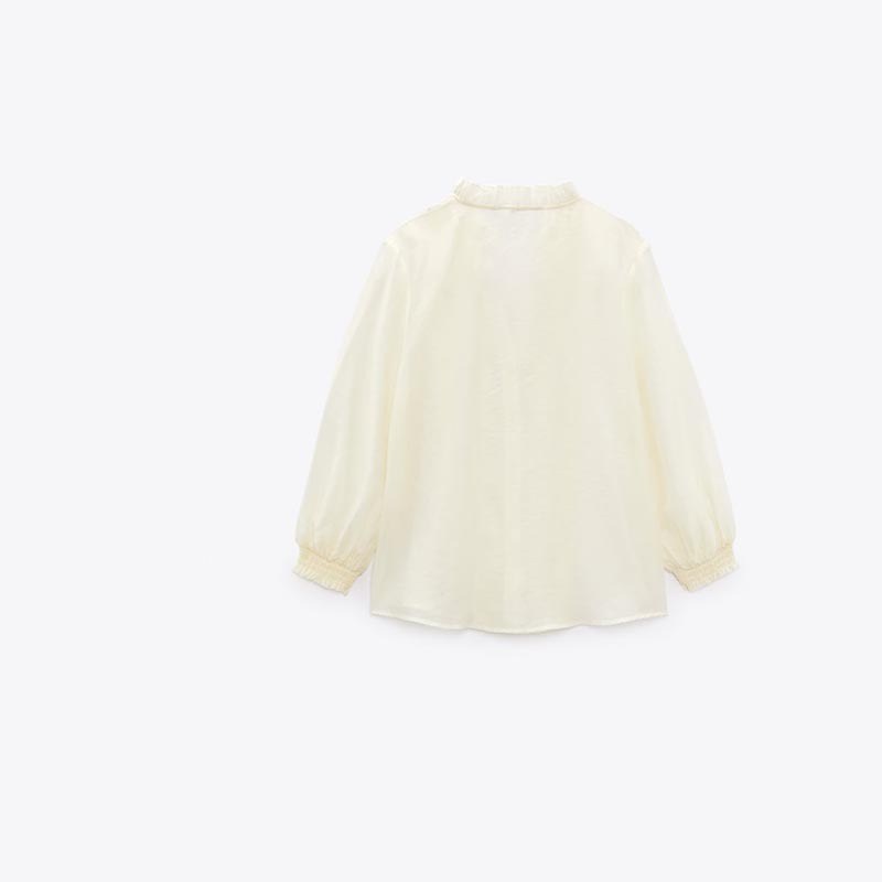 layered embellished translucent shirt