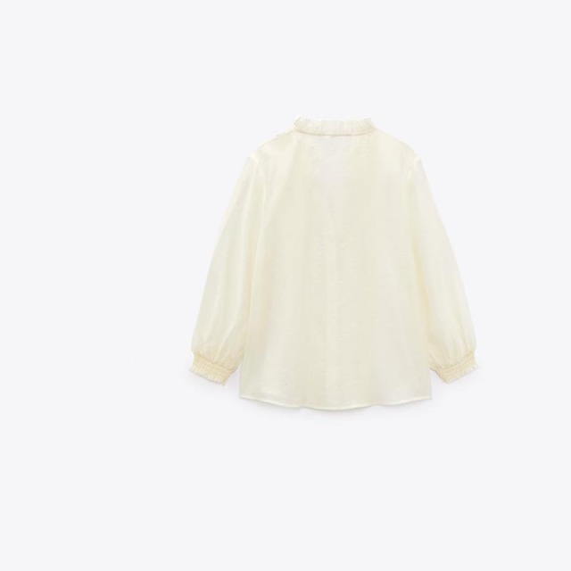 layered embellished translucent shirt