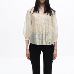 layered embellished translucent shirt