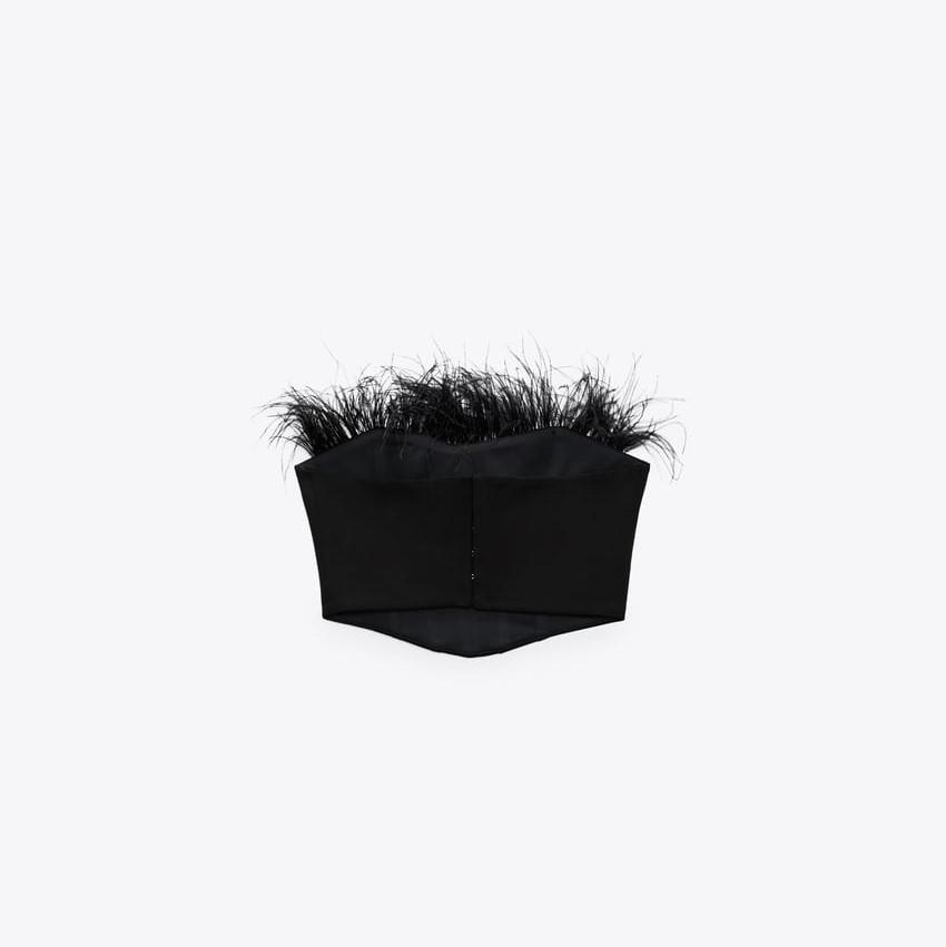 Corsetry-Inspired top with feathers