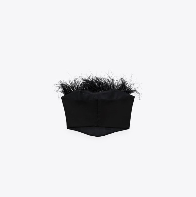 Corsetry-Inspired top with feathers