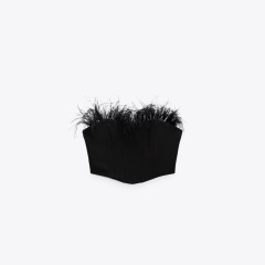 Corsetry-Inspired top with feathers