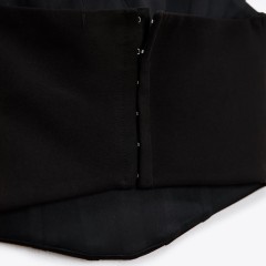 Corsetry-Inspired top with feathers