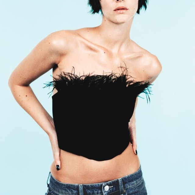 Corsetry-Inspired top with feathers