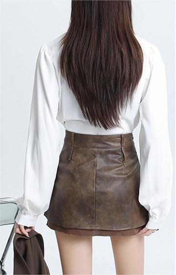 Hottie designs a short leather skirt