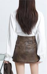 Hottie designs a short leather skirt
