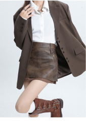 Hottie designs a short leather skirt