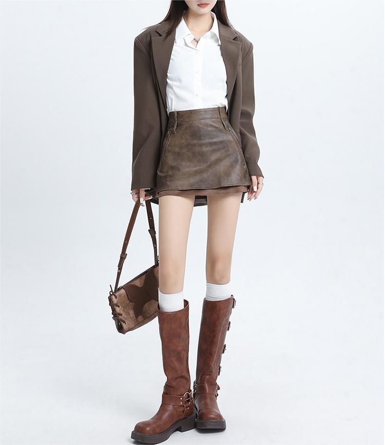 Hottie designs a short leather skirt