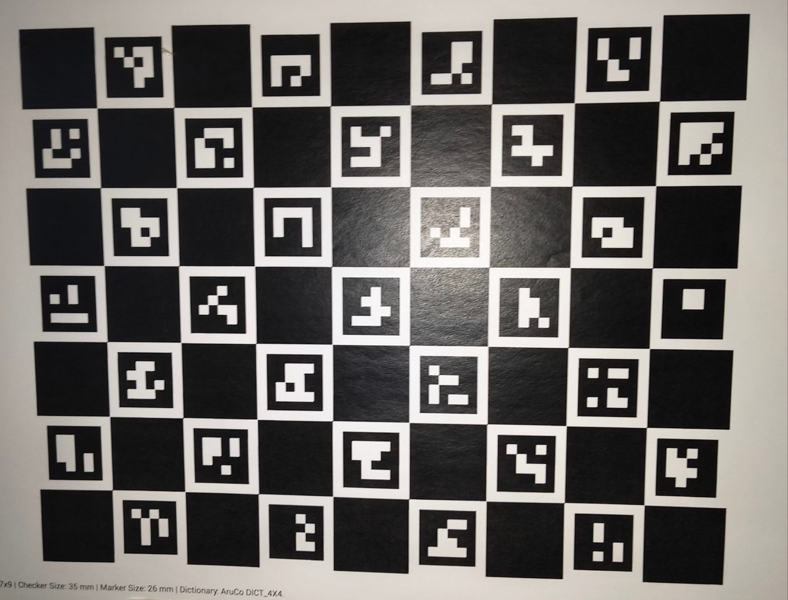 ChArUco calibration board 7×9, 35 mm checker size, 26 mm ArUco markers, DICT_4X4 — used for camera intrinsic calibration (EyeCloud AI camera calibration case study)