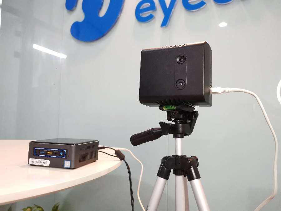 OpenNCC IR384 camera deployment: the camera on a tripod paired with an Intel NUC host at the EyeCloud AI office